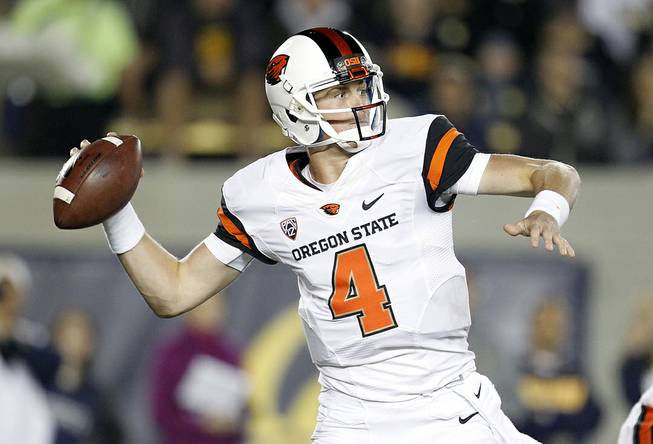 Oregon State quarterback Sean Mannion (4) throws a pass against California during the first quarter of an NCAA college football game in Berkeley, Calif., Saturday, Oct. 19, 2013. (AP Photo/Tony Avelar)