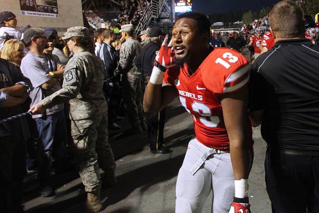 UNLV senior linebacker Eric Tuiloma-Vaa asks UNR fans "Who do I hear crying," after the Rebels beat the Wolf Pack 27-22 Saturday, Oct. 26, 2013 at Mackay Stadium in Reno.