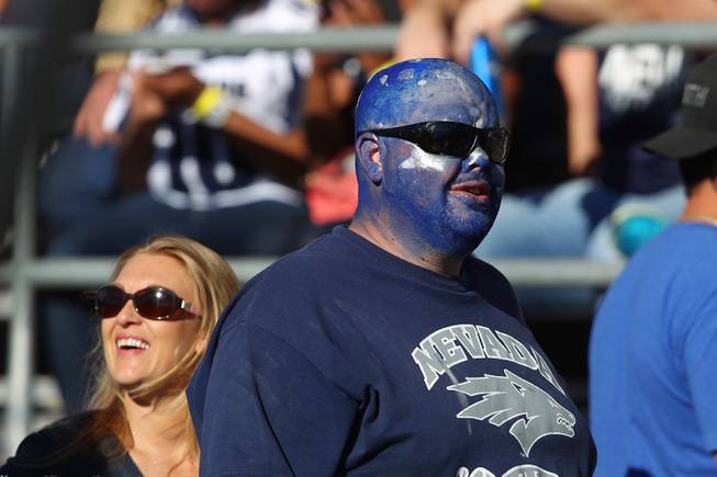 A UNR fan sports face paint during their game against UNLV Saturday, Oct. 26, 2013 at Mackay Stadium in Reno. UNLV defeated UNR 27-22 to reclaim the Fremont Cannon.