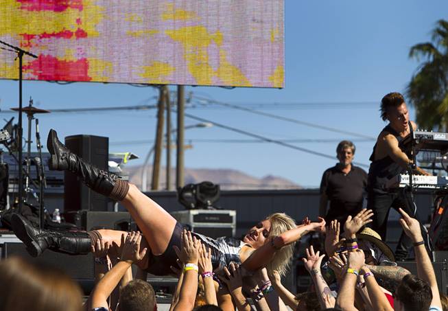 Five Knives front woman Anna Worstell crowd surfs at the Ambassador stage during the Life is Beautiful Festival in downtown Las Vegas Sunday, Oct. 27, 2012.