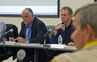 (From left) Commissioners Steve Sisolak and James Hammer with Sheriff Doug Gillespie listen to the details of a lawsuit settlement during a fiscal affairs committee meeting at the Metro Police headquarters Monday, Oct. 28, 2013. L.E. Baskow