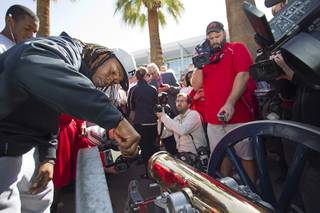 UNLV football players paint the Fremont cannon during a ceremony on UNLV campus Monday, Oct. 28, 2013. The UNLV football team beat Reno Saturday 27-22 to break an eight-year losing streak in the rivalry game and gain possession of the Fremont cannon.