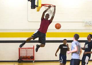 Jordan Turner dunks during intramurals at Clark High School Wednesday, Oct. 30, 2013.