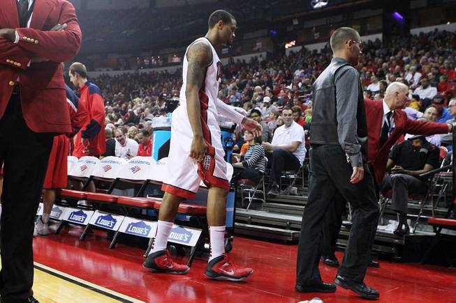 UNLV guard Bryce Dejean-Jones holds his hamstring as he heads to the locker room during the Rebels exhibition game against Dixie State Friday, Nov. 1, 2013 at the Thomas & Mack Center.