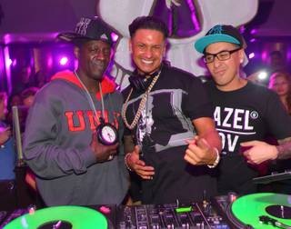 DJ Pauly D, center, with Flavor Flav and Kozmoe Alonzo, spins at Haze in Aria on Saturday, Nov. 2, 2013.