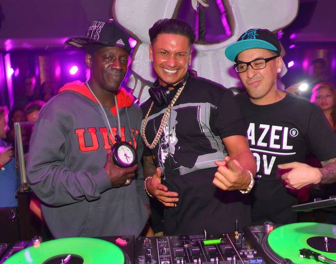 DJ Pauly D, center, with Flavor Flav and Kozmoe Alonzo, ...