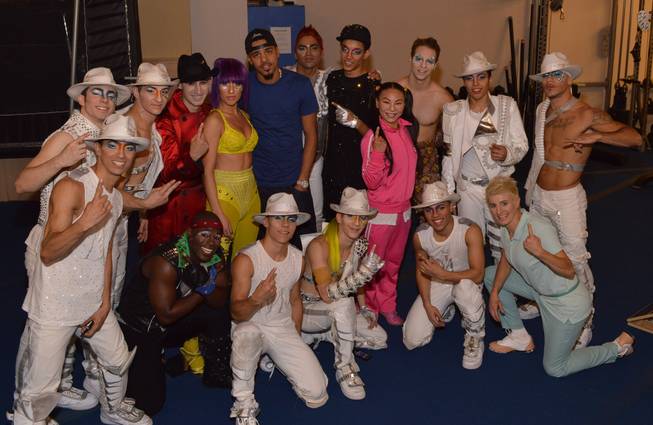 Rapper J Cole with cast members of Cirque du Soleil's "Michael Jackson One" at Mandalay Bay.