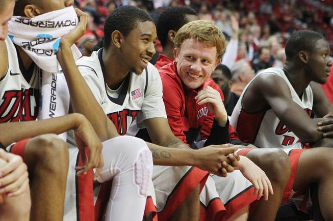 UNLV’s Daquan Cook and Dantley Walker share a light moment during the Adams State game Tuesday, Nov. 5, 2013, at the Thomas & Mack Center.

