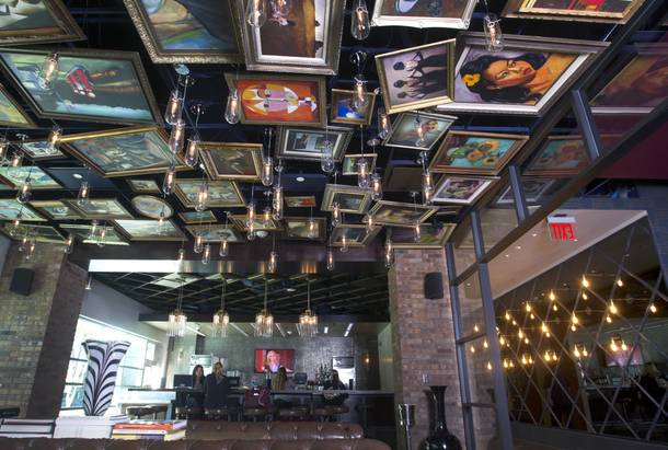 Replicas of famous paintings cover the ceiling of the Art Bar in the Downtown Grand Monday, Nov. 11, 2013.