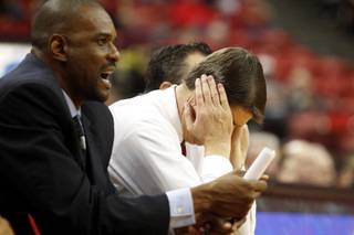 UNLV coach Dave Rice buries his head in his hands as UC Santa Barbara pulls away for a 86-65 upset Tuesday, Nov. 12, 2013 at the Thomas & Mack Center. 