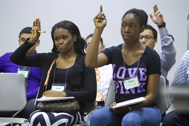 Chanell Westbrooks, left, and Ellamaze Velasquez, both of Arbor View High School, wait to join a discussion during the annual Las Vegas Sun Youth Forum at the Las Vegas Convention Center Wednesday, Nov. 13, 2013.