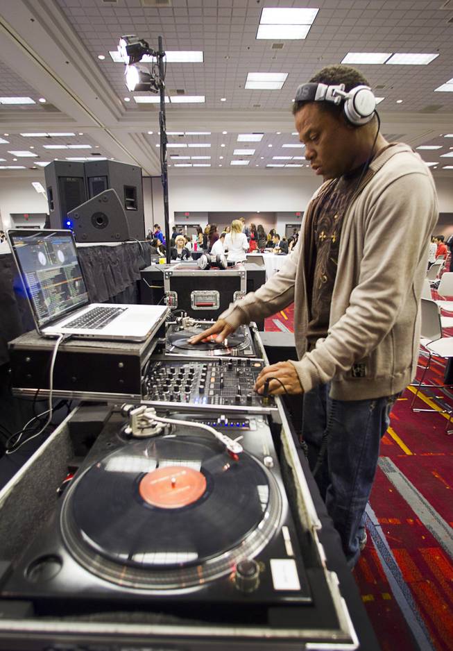 Darrell Sherrod, also know as DJ Twin, provides musical entertainment during a lunch break at the annual Las Vegas Sun Youth Forum in the Las Vegas Convention Center Wednesday, Nov. 13, 2013.
