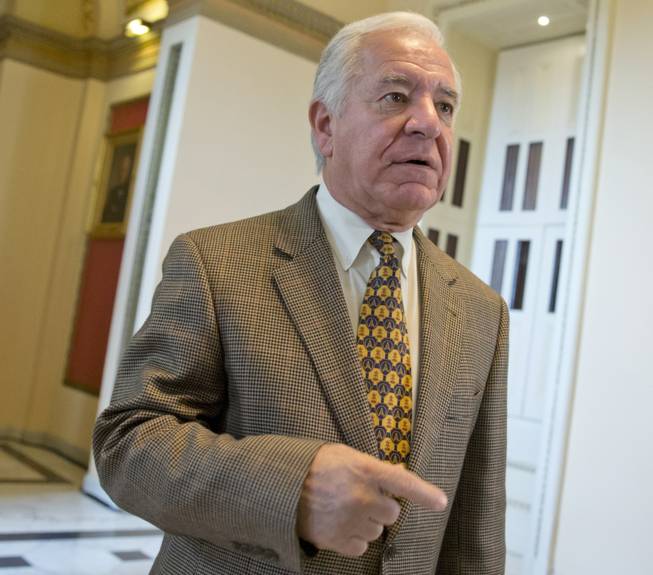 Rep. Nick Rahall, D-W.Va., walks on Capitol Hill in Washington, Friday, Nov. 15, 2013. In his West Virginia district, the TV ads attacking Rahall over the calamitous startup of President Barack Obama’s health care law have already begun. 