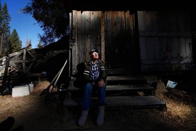 Jack English, 94, sits on the steps to his tool shed at his remote cabin in the Ventana Wilderness of California on Nov. 17, 2013.