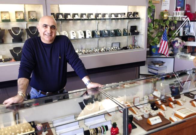 Alex Kassarjian operates the jewelry half of Alexs Shoe and Jewelry Repair, a 10-year-old Las Vegas business, on Nov. 18, 2013.