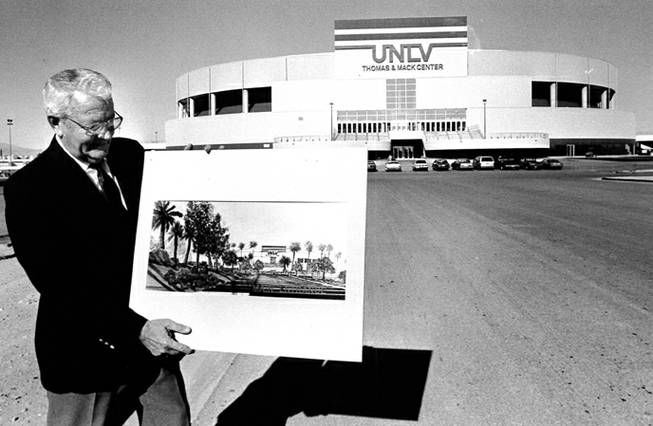 Bill Ireland, former mens Rebel basketball coach hold a rendering of the completed Thomas & Mack Center in 1983. Las Vegas Sun Archives