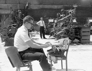 A Sun staffer pretends to use a typewriter in the burned out Las Vegas Sun building at 900 S. Main Street on April 23, 1964.  The building burned down on November 20, 1963.