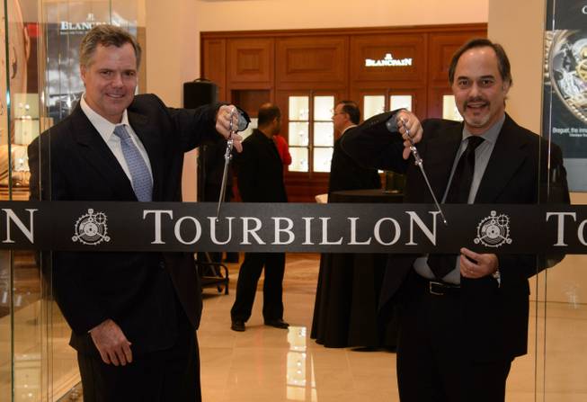 Jim Murren, CEO and chairman of MGM Resorts International, and Frank Furlan, president of Swatch Group U.S., cut the ribbon at the Tourbillon grand opening on Wednesday, Nov. 13, 2013, at Crystals in CityCenter.