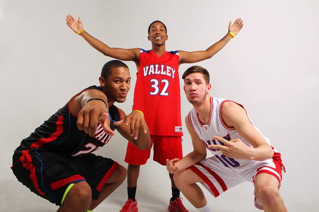 Valley basketball players, from left, Shea Garland, Cam Burton and Spencer Mathis Thursday, Nov. 21, 2013.