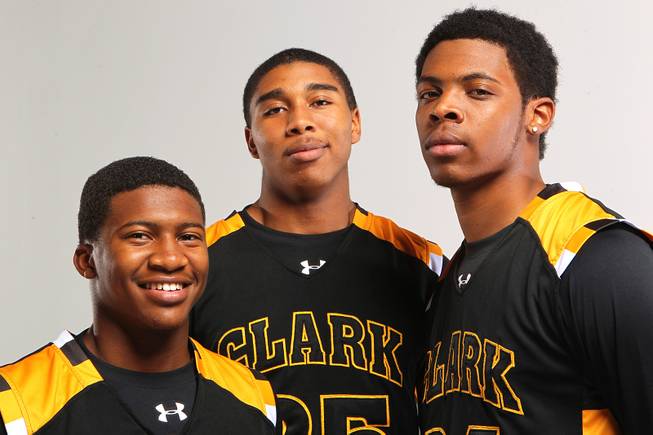 Clark basketball players, from left, Colby Jackson, Sherron Wilson and Diontae Jones Thursday, Nov. 21, 2013.
