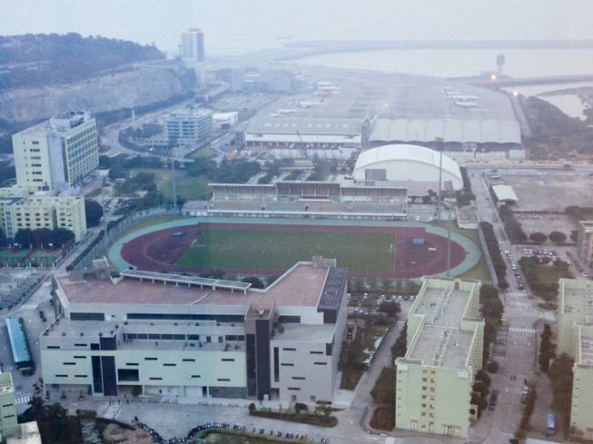 A view of the University of Macau track and soccer field from a Crown.Tower suite at City of Dreams in Macau.