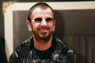 Ringo Starr appears at an event to promote the publication of his book of pictures Saturday, Nov. 23, 2013.