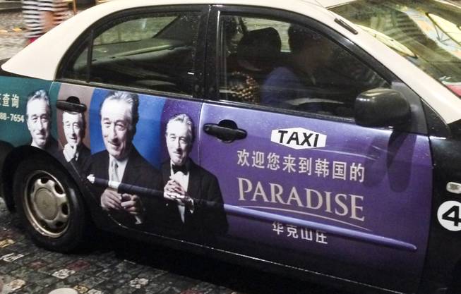 A cab in Macau advertising something with Robert De Niro.