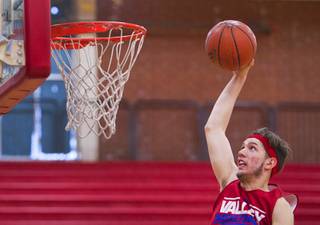Valley High School's Spencer Mathis prepares to dunk a ball during practice at the school Tuesday, Nov. 26, 2013.