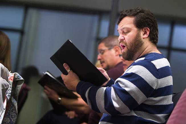 K.C. Chai and members of the Myron Heaton Chorale rehearse at Christ the Servant Lutheran Church in Henderson Tuesday, Nov. 26, 2013. The Chorale are scheduled to perform at the church on Dec. 8.