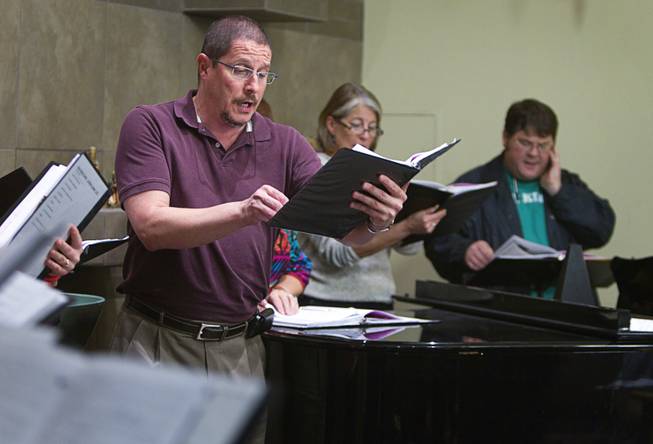 Fred Crescente, center, rehearses with members of the Myron Heaton Chorale at Christ the Servant Lutheran Church in Henderson Tuesday, Nov. 26, 2013. The Chorale are scheduled to perform at the church on Dec. 8.