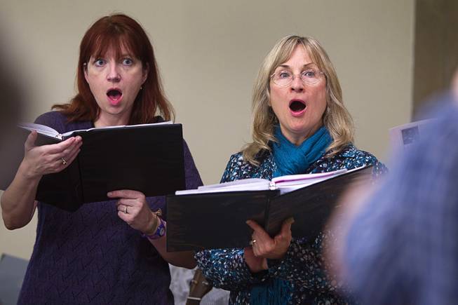 Katy Bleyle, left, and Connie Warling, members of the Myron Heaton Chorale, rehearse at Christ the Servant Lutheran Church in Henderson Tuesday, Nov. 26, 2013. The Chorale are scheduled to perform at the church on Dec. 8.