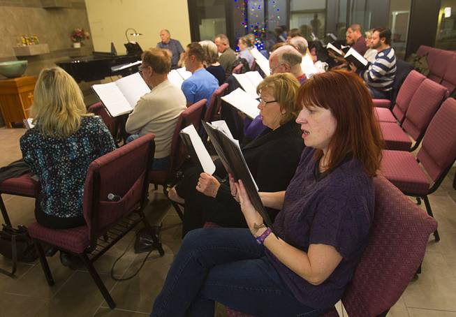 Katy Bleyle, center, and members of the Myron Heaton Chorale rehearse at Christ the Servant Lutheran Church in Henderson Tuesday, Nov. 26, 2013. The Chorale are scheduled to perform at the church on Dec. 8.