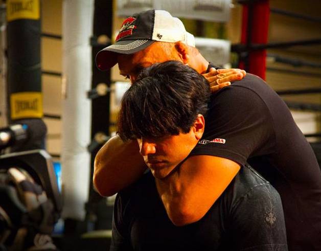Randy Couture puts Criss Angel in a choke hold on Angel’s Spike TV series “Believe.”