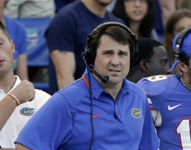 Florida head coach Will Muschamp watches the final minutes of an NCAA college football game against Georgia Southern in Gainesville, Fla., Saturday, Nov. 23, 2013. Georgia Southern won the game 26-20.