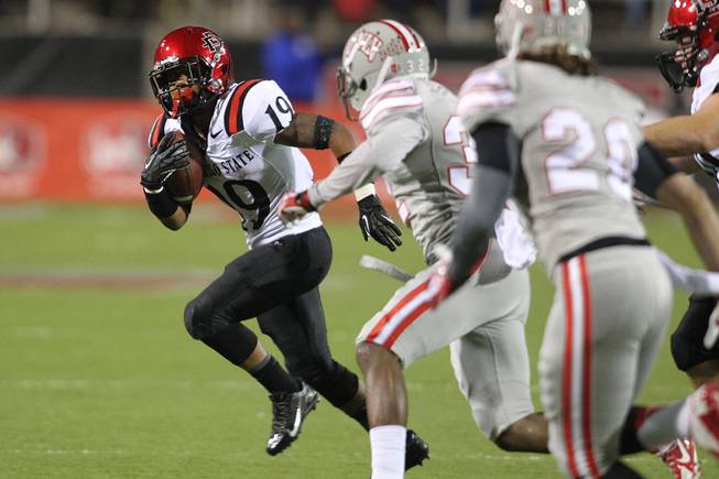 San Diego State running back Donnel Pumphrey looks for a way around the UNLV defense during their Mountain West Conference game Saturday, Nov. 30, 2013 at Sam Boyd Stadium. Pumphrey is a graduate of Canyon Springs High School.