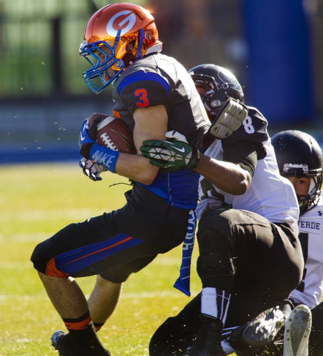 Bishop Gorman's Brandon Gahagan (3) is caught from behind by Palo Verde's Dallas White (8) during their regional championships on Saturday, Nov. 30, 2013.  L.E. Baskow