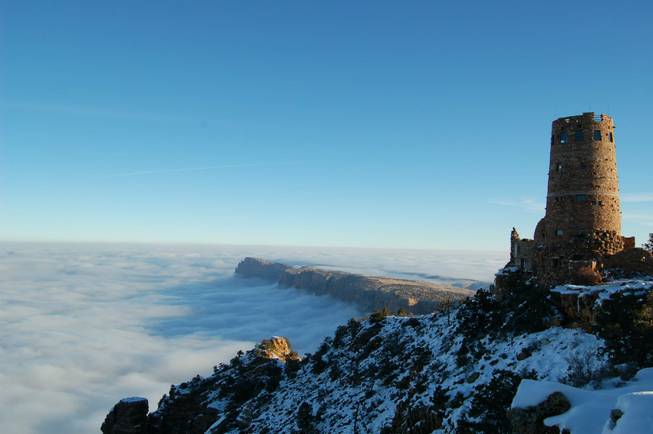 A photo from the recent inversion event at the Grand Canyon, where warm air traps cooler, moist air in the canyon, showing the Desert View Watchtower. National Park Service photo by Erin Whittaker