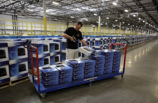 In this image released on Tuesday, Nov. 12. 2013, an Amazon Fulfillment Center prepares for its release-date delivery of the Sony PlayStation 4 Launch Edition.