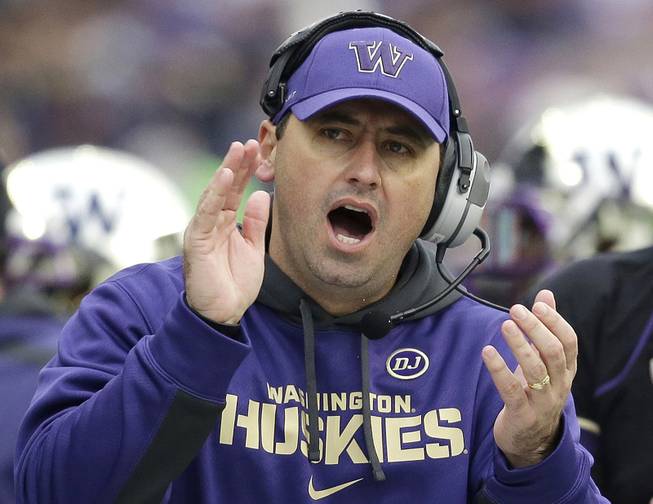 Washington head coach Steve Sarkisian yells from the sidelines in the second half of an NCAA college football game against Washington State in Seattle, Nov. 29, 2013.