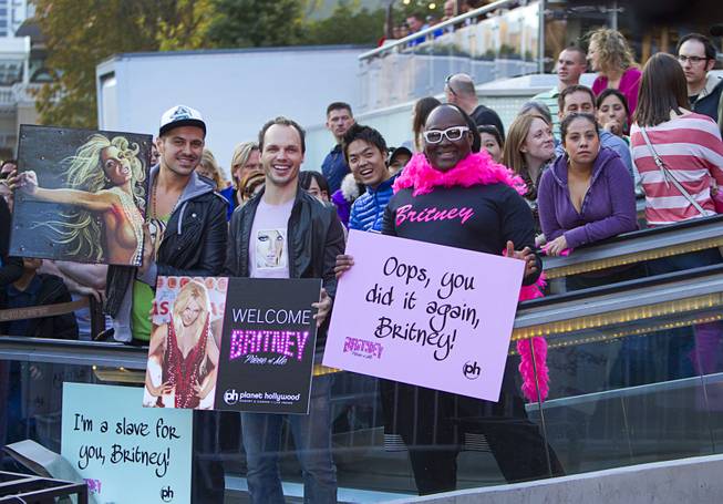 Fans, including entertainer Larry Edwards, right, wait for Britney Spears to arrive at Planet Hollywood on Tuesday, Dec. 3, 2013. Spears is making preparations for the debut of her two-year residency, “Britney: Piece of Me,” that is scheduled to begin at Planet Hollywood on Dec. 27. 