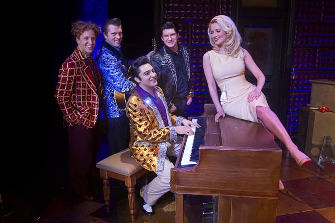 Holly Madison poses with cast members after a guest performance in "Million Dollar Quartet" at Harrah's Wednesday, Dec. 4, 2013.  Madison performed "The Lady Loves Me" with Justin Shandor who plays Elvis Presley. From left are: Martin Kaye as Jerry Lee Lewis, Robert Britton Lyons as Carl Perkins, Shandor, and Benjamin D. Hale as Johnny Cash.