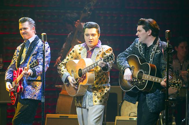 Robert Britton Lyons, left, as Carl Perkins, Justin Shandor, center, as Elvis Presley, and Benjamin D. Hale as Johnny Cash perform during "Million Dollar Quartet" at Harrah's Wednesday, Dec. 4, 2013.