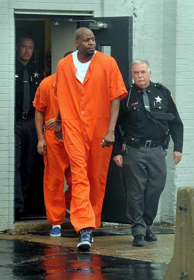 Former NBA player Keon Clark exits the Vermilion County Courthouse in Danville, Ill., on Wednesday Dec. 4, 2013. Clark was sentenced to eight years in prison on Wednesday after pleading guilty to weapons and driving under the influence charges in two separate cases.