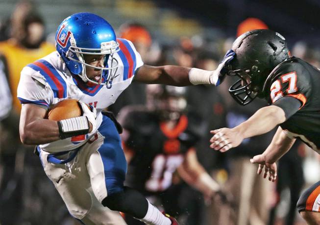 Memphis University School's Chris Davis, left, tries to get past Ensworth's Hunter Travis (27) in the second quarter of the Division II Class AA Tennessee high school football championship game on Thursday, Dec. 5, 2013, in Cookeville, Tenn. 