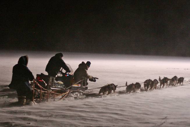 In this March 2010 photo provided by Anker Productions, a film crew follows a dog team during the making of the documentary "Icebound," in Nenana, Alaska.