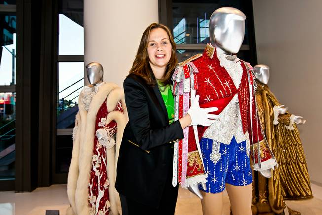 Curator Deirdre Clemente, PhD, shows the intricate designs of Liberace's rhinestone Red, White and Blue hot pants ensemble while giving a walk-through of the Liberace Exhibition at the Cosmopolitan in Las Vegas Deceber 6, 2013.  Clemente is assistant professor of history and associate director of the public history program at the University of Nevada, Las Vegas. She also served as historical consultant for Buz Luhrmanns The Great Gatsby.