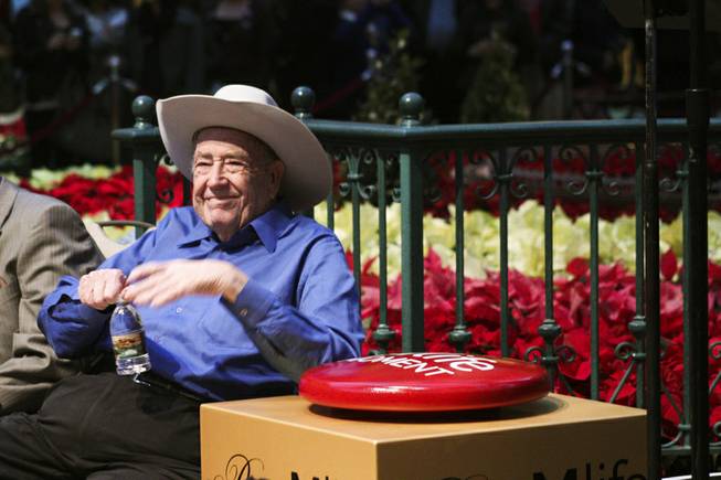 WSOP champion Doyle Brunson gets the honor of switching on the lights for the 42' Christmas tree at the Bellagio Conservatory during the tree lighting ceremony Friday, Dec. 6, 2013.
