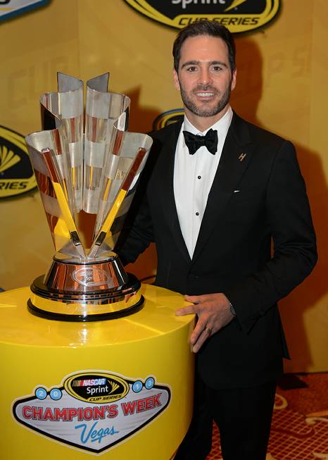 Jimmie Johnson stands with his sixth championship trophy after the ...