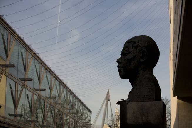 A view of the statue of former South African president Nelson Mandela, at the side of the Royal Festival Hall on the south bank of London, Friday, Dec. 6, 2013. 