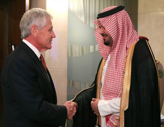 U.S. Secretary of Defense Chuck Hagel, left, greets Saudi Arabia Deputy Minister of Defense Prince Salman bin Sultan, before a meeting at the Radisson Hotel, on Friday, Dec. 6, 2013, in Manama, Bahrain. 